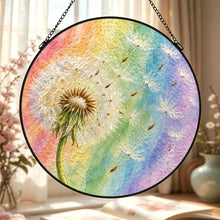 Carica l'immagine nel visualizzatore di Gallery, Close-up of the Wish Come True glass suncatcher in a sunlit setting, displaying delicate dandelion seeds and softly blended pastel rainbow hues.