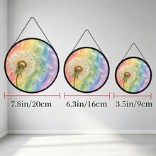 Carica l'immagine nel visualizzatore di Gallery, Three Wish Come True dandelion glass suncatchers hanging side by side in different sizes, each featuring pastel rainbow artwork.