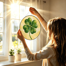 Load image into Gallery viewer, Lucky Charm glass suncatcher featuring a green four-leaf clover with beautifully layered brushwork against a soft golden-yellow background.