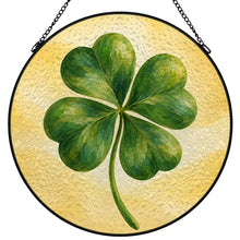 Load image into Gallery viewer, Lucky Charm glass suncatcher featuring a green four-leaf clover with beautifully layered brushwork against a soft golden-yellow background.