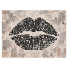 Load image into Gallery viewer, Lip Print jigsaw puzzle featuring an oversized black lip impression on a layered neutral cream, taupe, gray and stone background, from Little Yellow Bungalow.