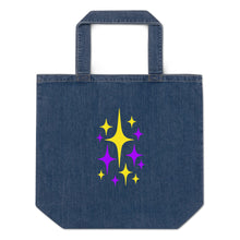 Load image into Gallery viewer, Astro Glow organic cotton denim tote bag with electric purple and luminous yellow starburst artwork by Little Yellow Bungalow