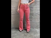 Load and play video in Gallery viewer, RISEN Bailey High Rise Raw Side Slit Hem Flared Leg Pink Denim Jeans