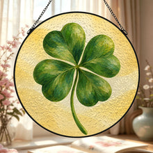 Carica l'immagine nel visualizzatore di Gallery, Lucky Charm glass suncatcher featuring a green four-leaf clover with beautifully layered brushwork against a soft golden-yellow background.
