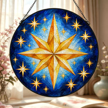 Загрузить изображение в средство просмотра галереи, Close-up of the Written in the Stars decorative glass suncatcher displayed near a window, highlighting golden stars and layered blue brushwork.
