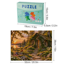 Загрузить изображение в средство просмотра галереи, THE OPEN DOOR 500 piece wooden jigsaw puzzle featuring an abandoned ivy covered cottage with a glowing cracked door, woodland path, sunset lake, fox, rabbit, and wildflowers.
