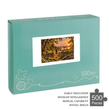 Carica l'immagine nel visualizzatore di Gallery, READY 500 piece wooden jigsaw puzzle featuring a woman walking through an open gate toward a glowing lake at sunset with wildflowers, deer, and a rabbit.
