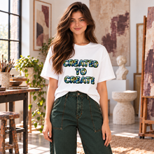 Carregar imagem no visualizador da galeria, Created to Create women’s organic t-shirt featuring Earth filled lettering with oceans, continents, and clouds.
