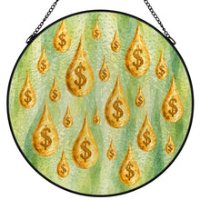 Carica l'immagine nel visualizzatore di Gallery, Make It Rain stained glass-style suncatcher featuring golden dollar-sign raindrops on a green background, with a black metal frame and hanging chain.
