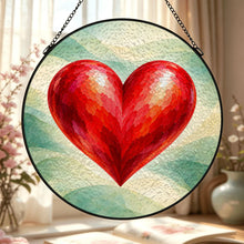 Carica l'immagine nel visualizzatore di Gallery, Close-up of the Follow Your Heart decorative glass suncatcher featuring a vivid red heart and softly blended green and cream artwork.
