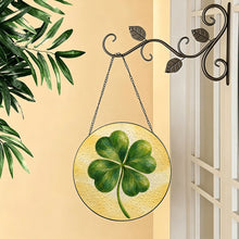 Carica l'immagine nel visualizzatore di Gallery, Lucky Charm glass suncatcher featuring a green four-leaf clover with beautifully layered brushwork against a soft golden-yellow background.
