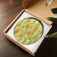 Carica l'immagine nel visualizzatore di Gallery, Make It Rain decorative glass suncatcher presented in an open gift box, featuring golden dollar-sign raindrops against a green background.

