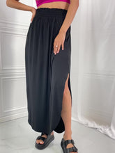 Load and play video in Gallery viewer, Zenana Solid Black Smocked Waist Slit Side Curved Hem Maxi Skirt
