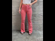 Load and play video in Gallery viewer, RISEN Bailey High Rise Raw Side Slit Hem Flared Leg Pink Denim Jeans
